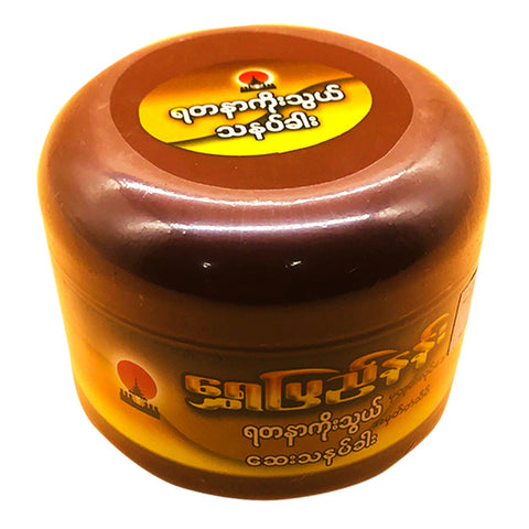 Jar of cream with a brown lid on a white background