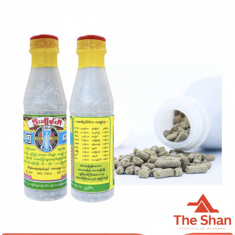 Two bottles with yellow labels and red caps on a white background, with 'The Shan' logo visible.