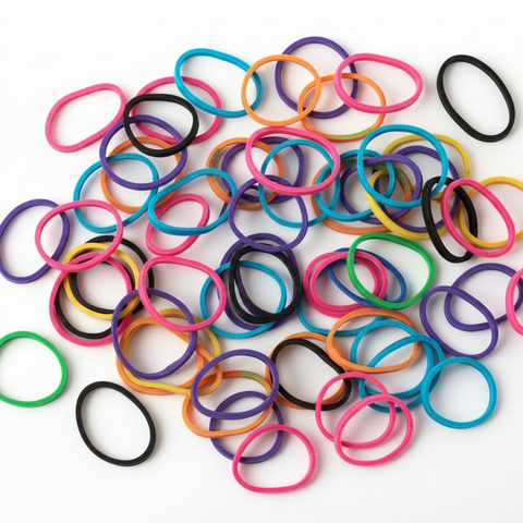 spreaded assorted rubber hair bands on the white background