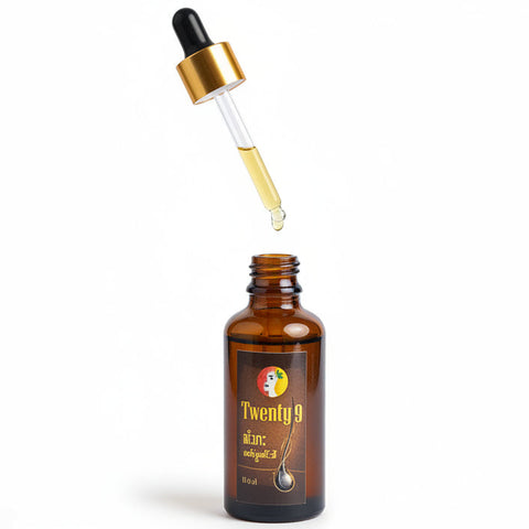 Bottle of 'Twenty 4' with dropper against a blurred green and pink floral background